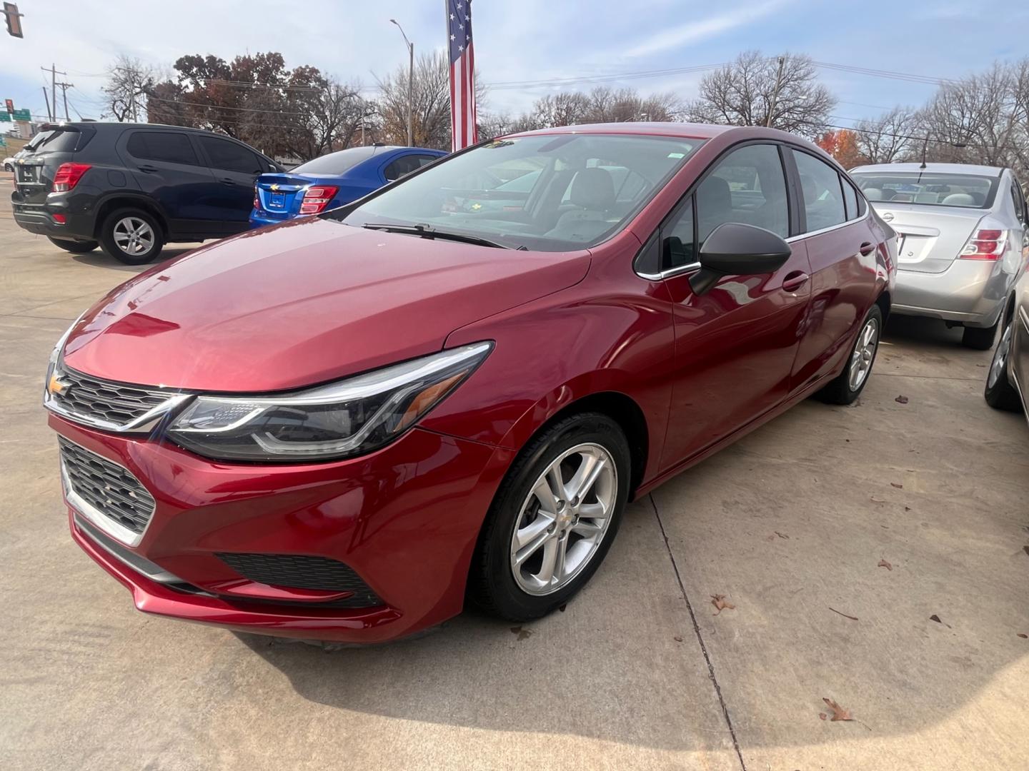 2017 RED CHEVROLET CRUZE LT LT Auto (1G1BE5SM8H7) with an 1.4L L4 DOHC 16V TURBO engine, 6A transmission, located at 8101 E. Skelly Dr., Tulsa, OK, 74129, (918) 592-3593, 36.121891, -95.888802 - Photo#3